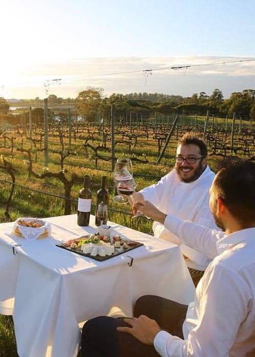 3. (3) a group of men sitting at a table with wine glasses in Portugal